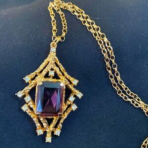 Sarah Coventry amethyst 24” necklace. Golden tone signed, lots of sparkle.